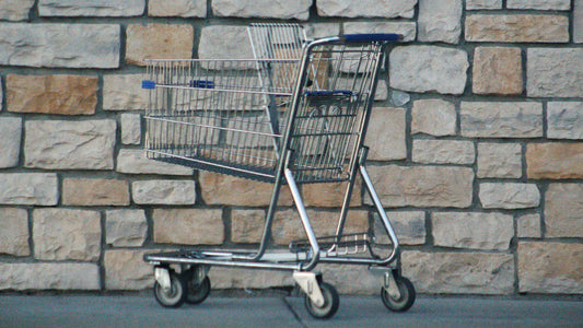 Empty shopping cart outdoors supporting flexibility tradeoffs and ongoing operational overhead in platform choice