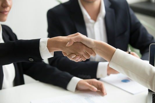 Partnership handshake agreement supporting what store owners get wrong about Shopify B2B