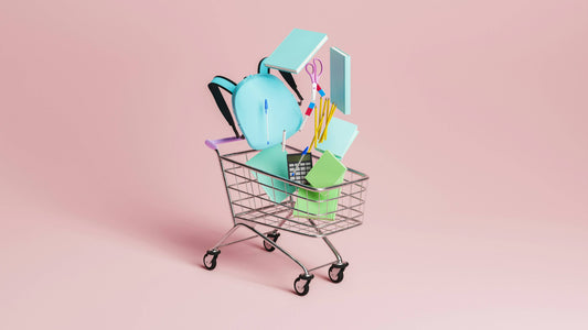 School supplies falling into a shopping cart supporting when hobby platforms outgrow serious ecommerce needs