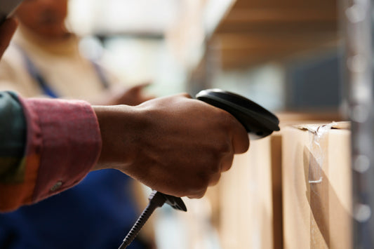 Warehouse barcode scanning supporting ERP-connected migration execution on Shopify